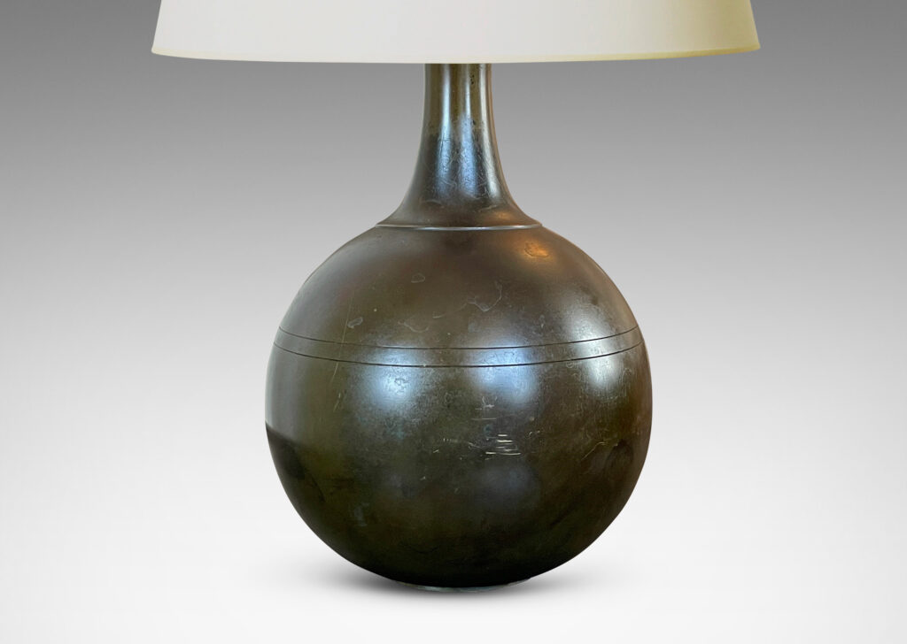 Gallery BAC globe form with coved neck and pinstripe details; patinated cast bronze