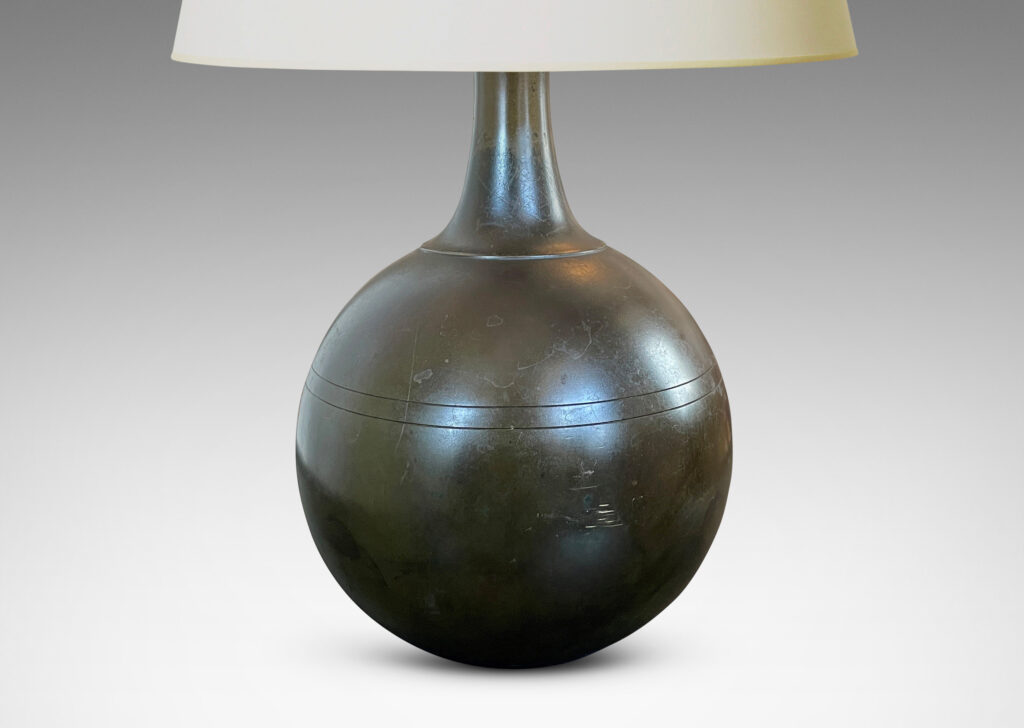 Gallery BAC globe form with coved neck and pinstripe details; patinated cast bronze