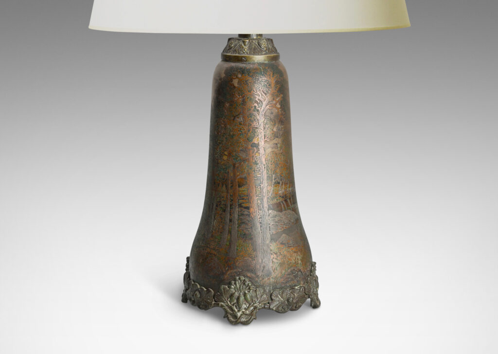 Gallery BAC tall undulating bell form with wonderfully detailed countryside scenes in low relief, with applied cast bottom edging decorated with pine boughs