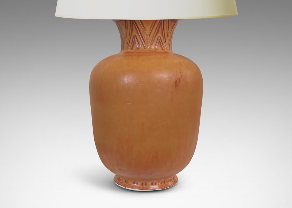 Gallery BAC tapered forms with flared necks carved with an Egyptian style chevron pattern, glazed in burnt sienna and butterscotch tones