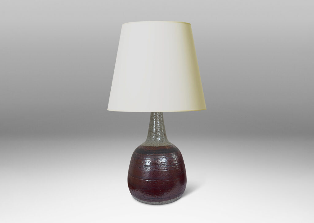 Gallery BAC bulbous forms with tall, conical necks, glazed in pale gray with burgundy luster