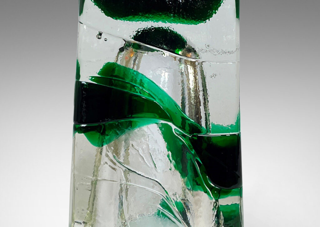 Gallery BAC raked four-sided forms in clear and alpine green glass; hand-formed crystal with brass mounts