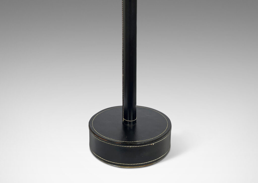 Gallery BAC stand and disk base covered in stitched black leather; brass, leather