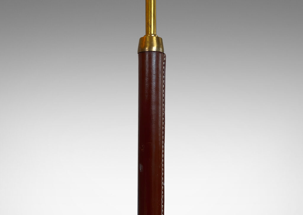 Gallery BAC stand covered in brown stitched leather with disk base ; brass, leather