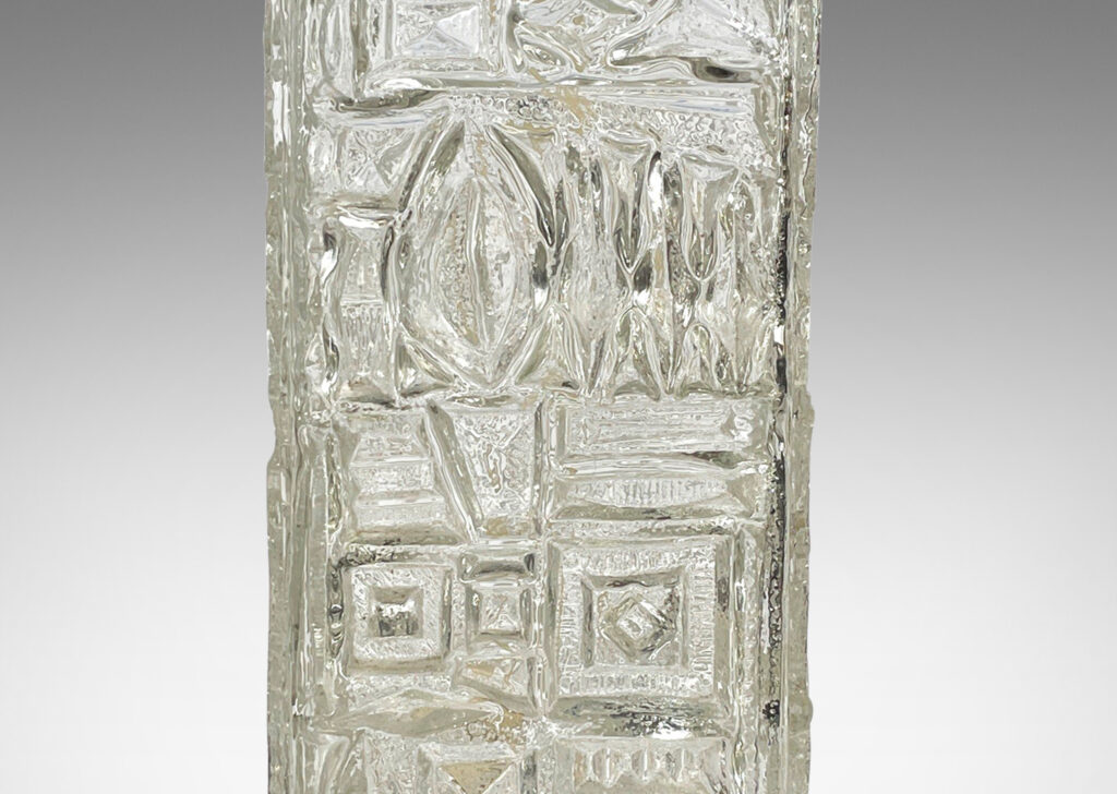 Gallery BAC square canister forms with various geometric designs in reliefs; clear mold-blown glass