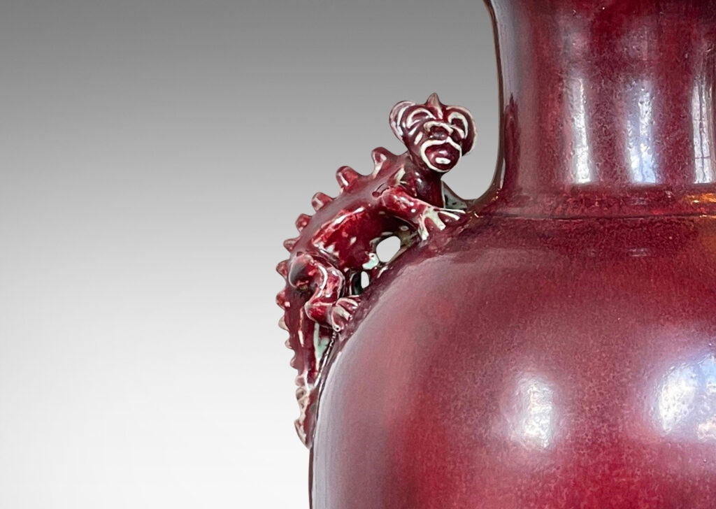 Gallery BAC plump globe form with wide mouth/neck and charming chameleon figure handles, glazed in a deep burgundy oxblood