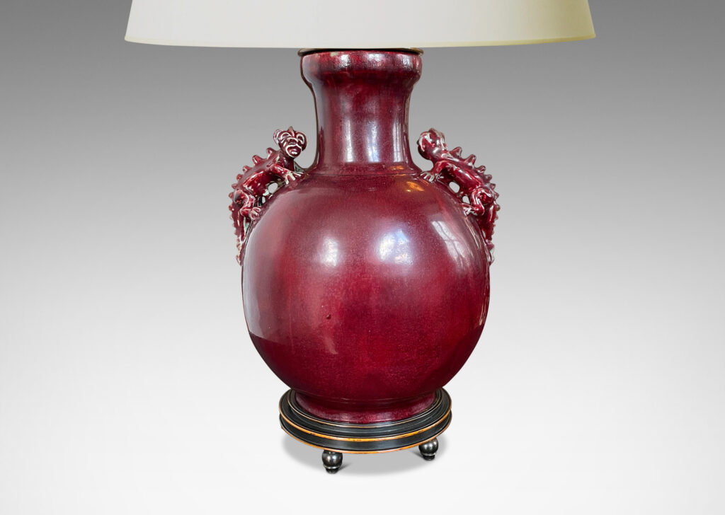 Gallery BAC plump globe form with wide mouth/neck and charming chameleon figure handles, glazed in a deep burgundy oxblood