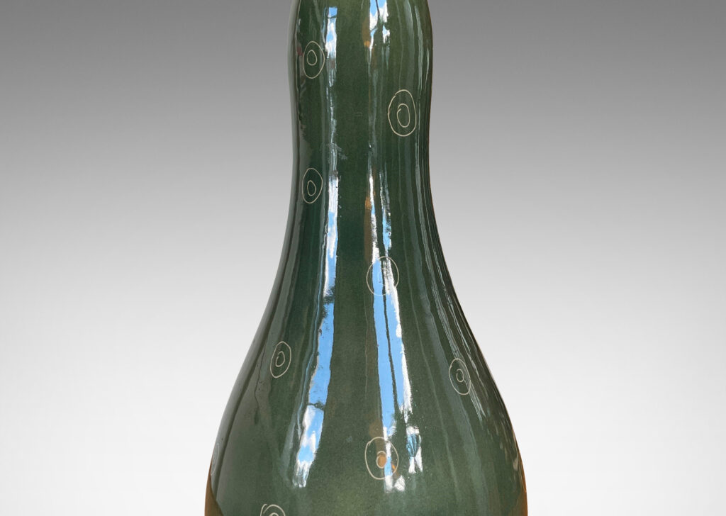 Gallery BAC attenuated double gourd form in shiny olive green glaze with sgraffito ring motifs