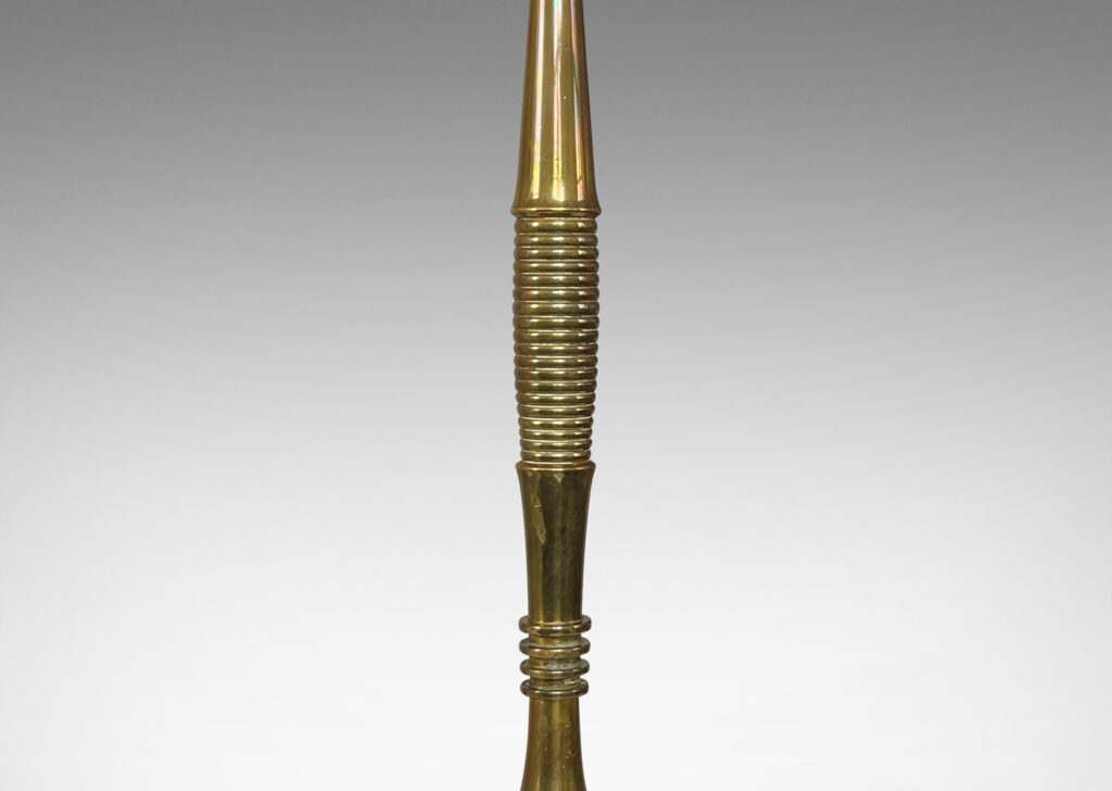 Gallery BAC swelling stand articulated with reeded and fluted bands springing from a disk base; cast brass