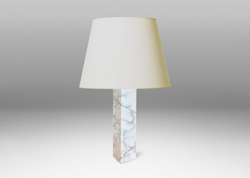 Gallery BAC having square pillar forms cut from solid marble in white with gray graining;