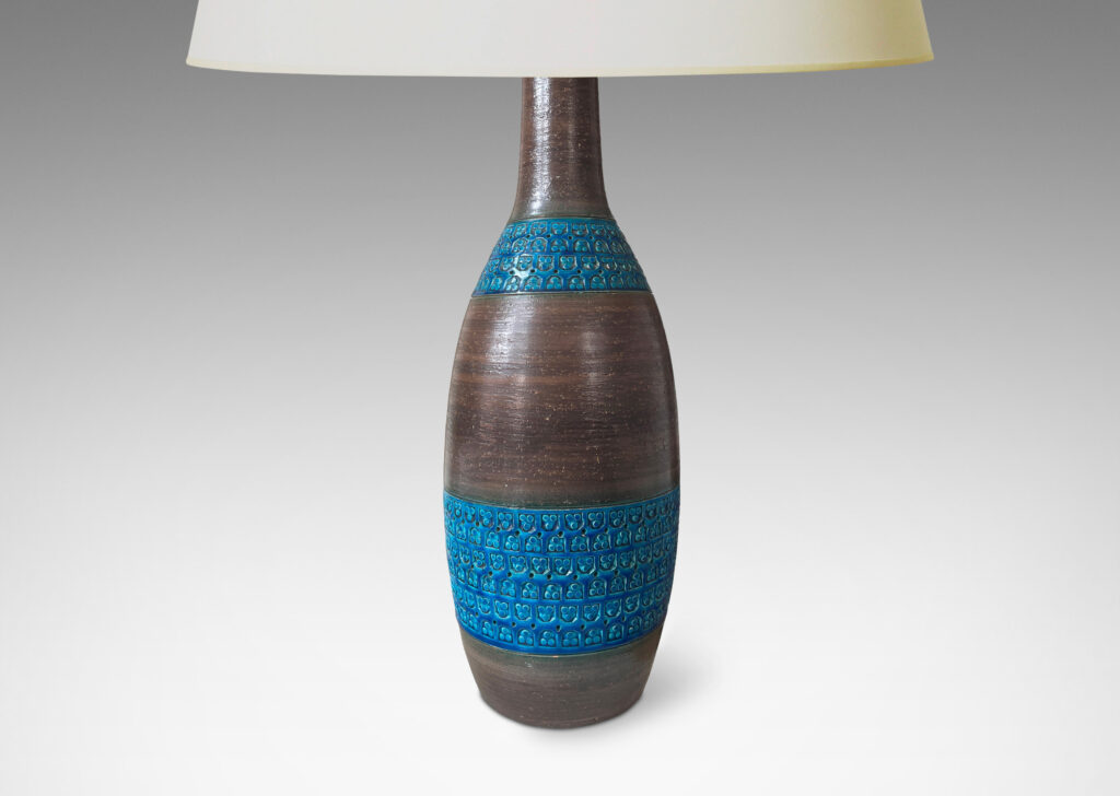 Gallery BAC tall ovoid body and long neck in a cool brown, with bands of impressed geometric patterns in a saturated cerulean blue