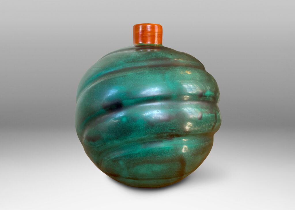 Gallery BAC tapering globe form with diagonal concentric lobes glazed in tonal teal green with persimmon orange