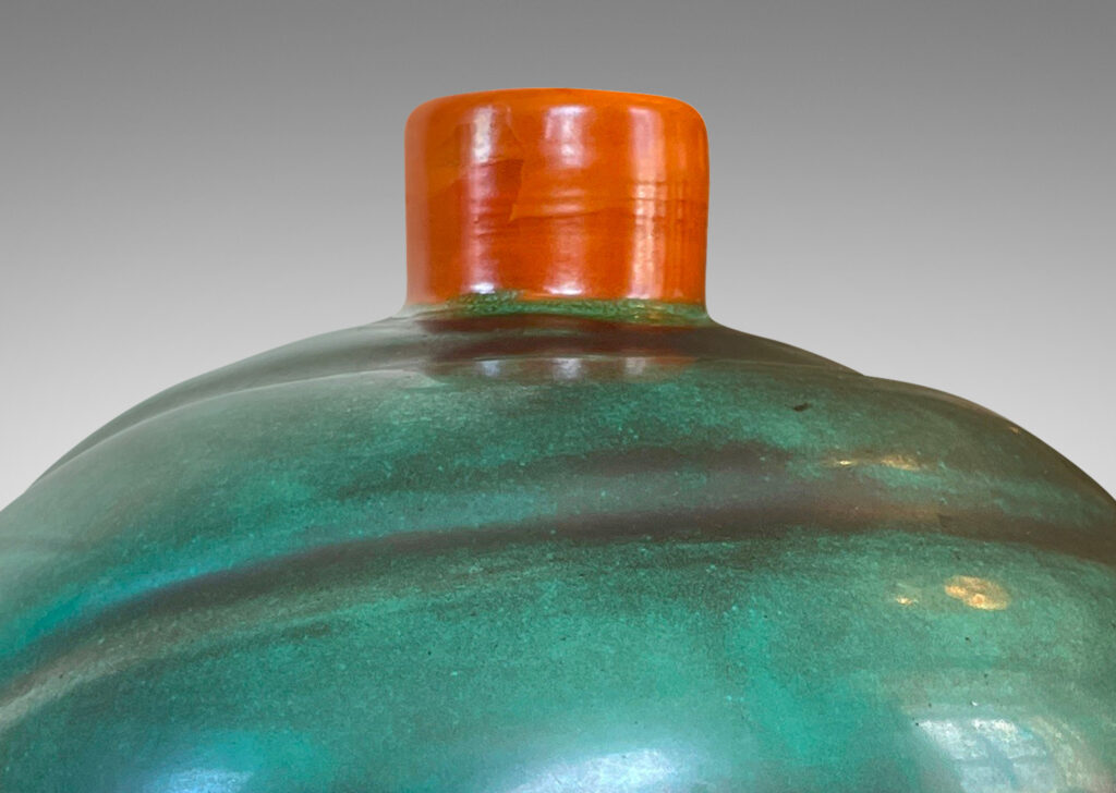 Gallery BAC tapering globe form with diagonal concentric lobes glazed in tonal teal green with persimmon orange