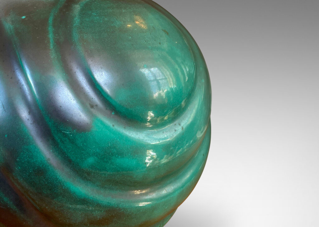 Gallery BAC tapering globe form with diagonal concentric lobes glazed in tonal teal green with persimmon orange