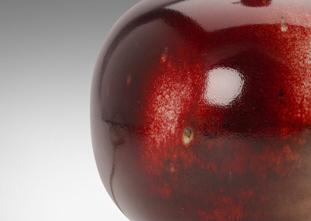 Gallery BAC plump globe form with sprouting neck, glazed in oxblood burgundy