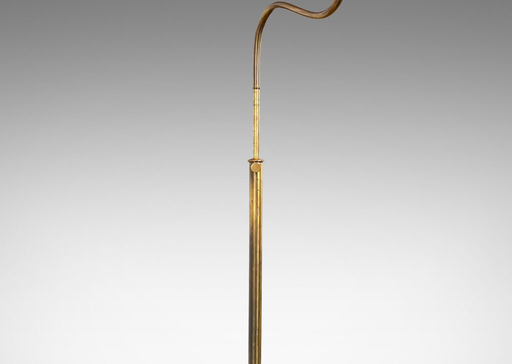 Gallery BAC stands with scroll arms (adjustable in height and direction) and a disk plinth; brass with wood feet and iron weight