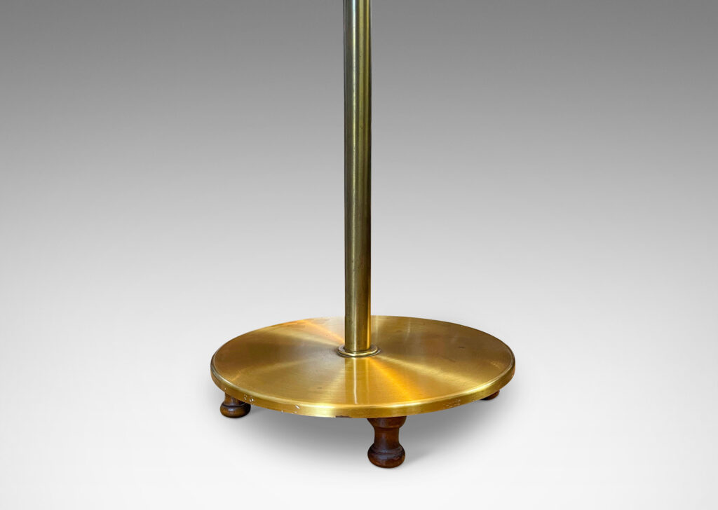 Gallery BAC stands with scroll arms (adjustable in height and direction) and a disk plinth; brass with wood feet and iron weight