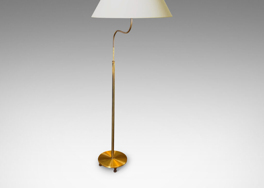 Gallery BAC stands with scroll arms (adjustable in height and direction) and a disk plinth; brass with wood feet and iron weight