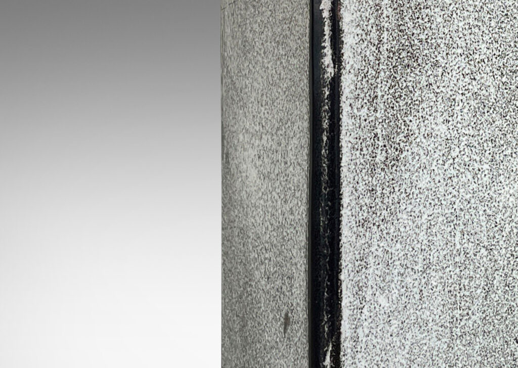 Gallery BAC tall square canister form with chamfered edges in a white-black tin glaze