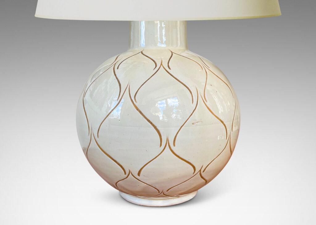 Gallery BAC globe form with wide neck glazed in a gloss ivory and decorated with a sgraffito ogival/leaf pattern