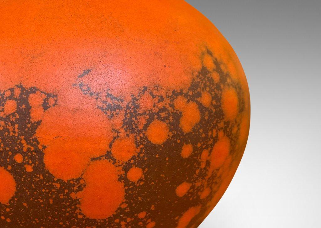 Gallery BAC plump globe form, glazed in a matte orange and port/brown