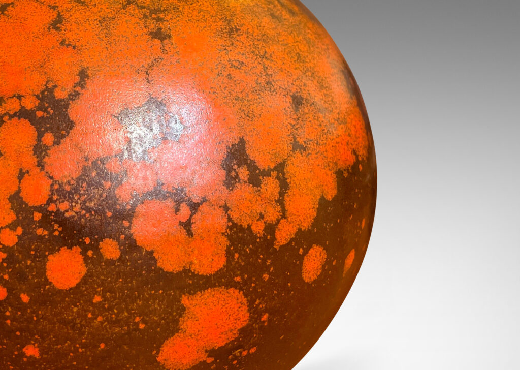 Gallery BAC plump globe form, glazed in a matte orange and port/brown