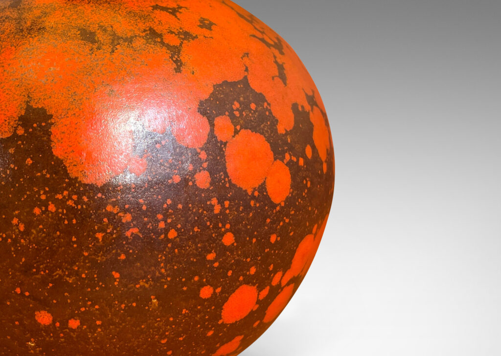 Gallery BAC plump globe form, glazed in a matte orange and port/brown