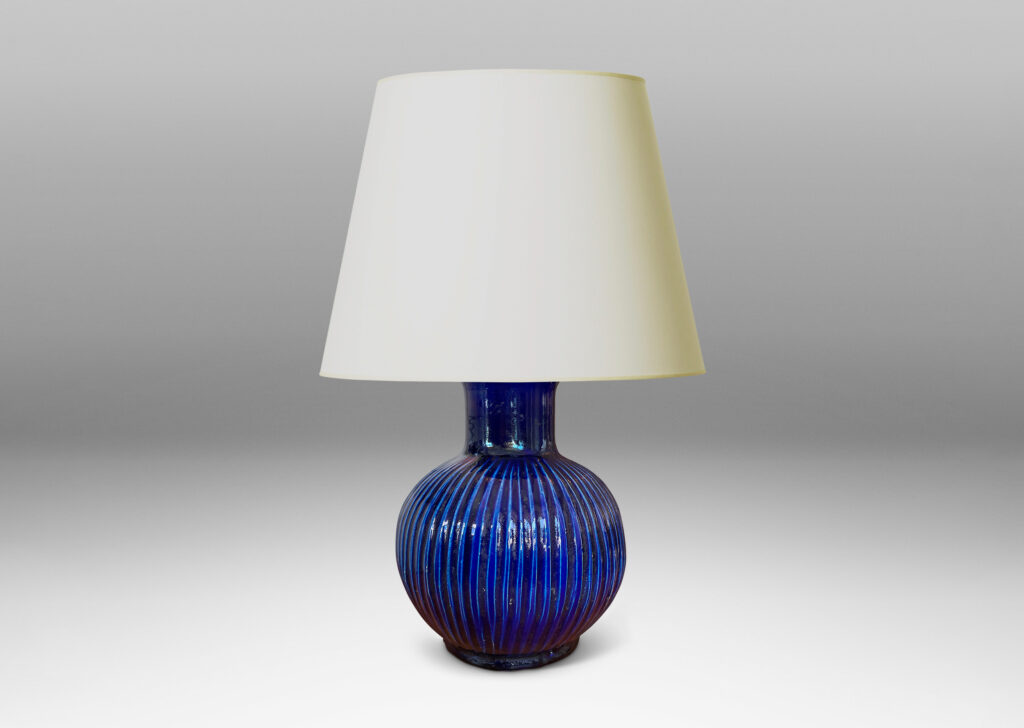 Gallery BAC plump pumpkin form with carved vertical ribs and wide neck, glazed in a gloss saturated deep blue