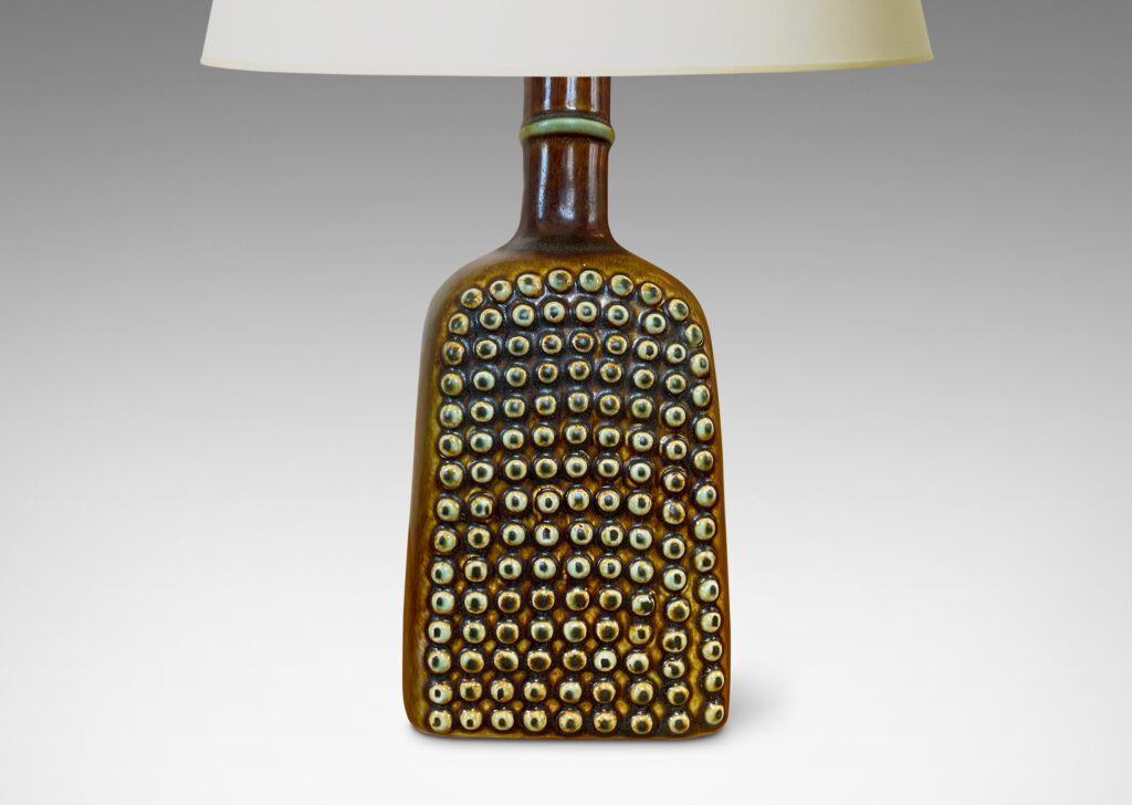 Gallery BAC squared bottle-like form with a grid of cleats on two sides in a raw umber brown glaze