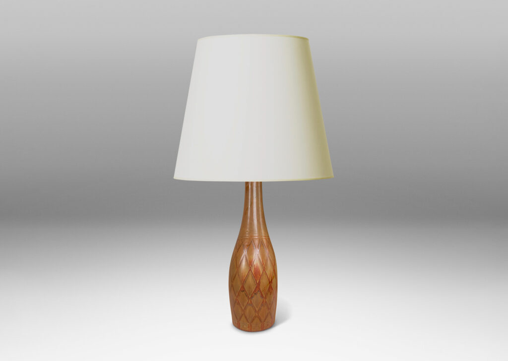 Gallery BAC tall bottle forms with carved diamond pattern, and glazed in terra-cotta/tan