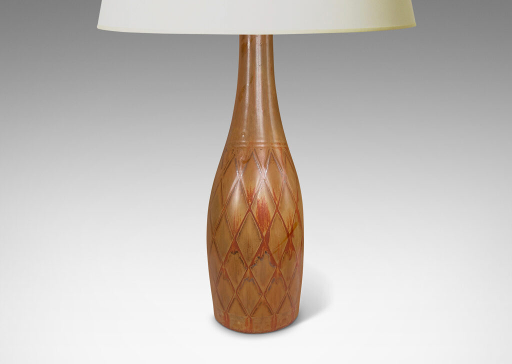 Gallery BAC tall bottle forms with carved diamond pattern, and glazed in terra-cotta/tan