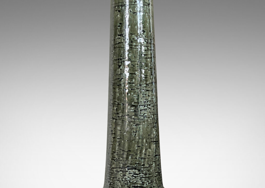 Gallery BAC drum form with carved line panels and tall conical neck, glazed in a gray-green