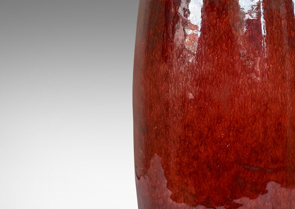 Gallery BAC organically modeled bottle form, glazed in a warm burgundy-oxblood