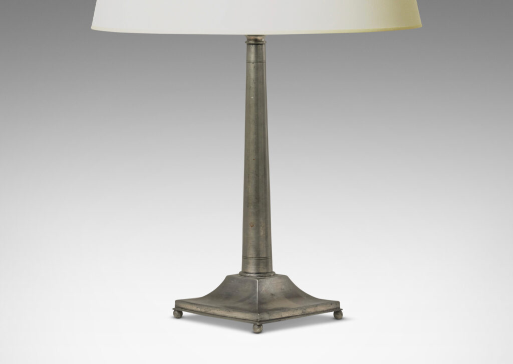 Gallery BAC column form elegantly modeled with entasis and ornamented with simple engraved pinstripes, on square plinth with mitered and coved profile