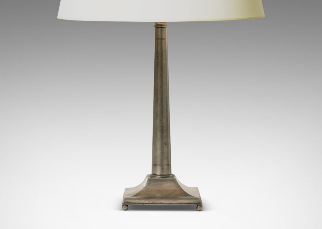 Gallery BAC column form elegantly modeled with entasis and ornamented with simple engraved pinstripes, on square plinth with mitered and coved profile