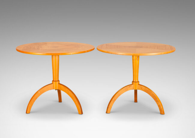 Gallery BAC round tops crafted from solid bookmatched wedges, on dynamically arced tripod bases; elm and birch