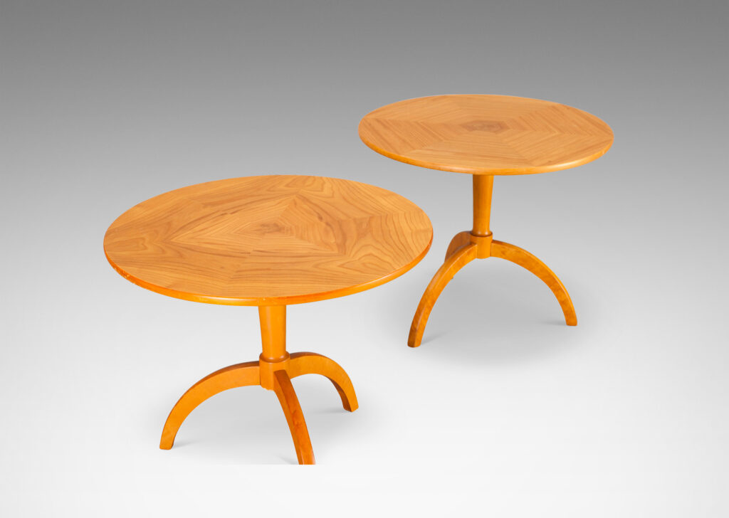 Gallery BAC round tops crafted from solid bookmatched wedges, on dynamically arced tripod bases; elm and birch