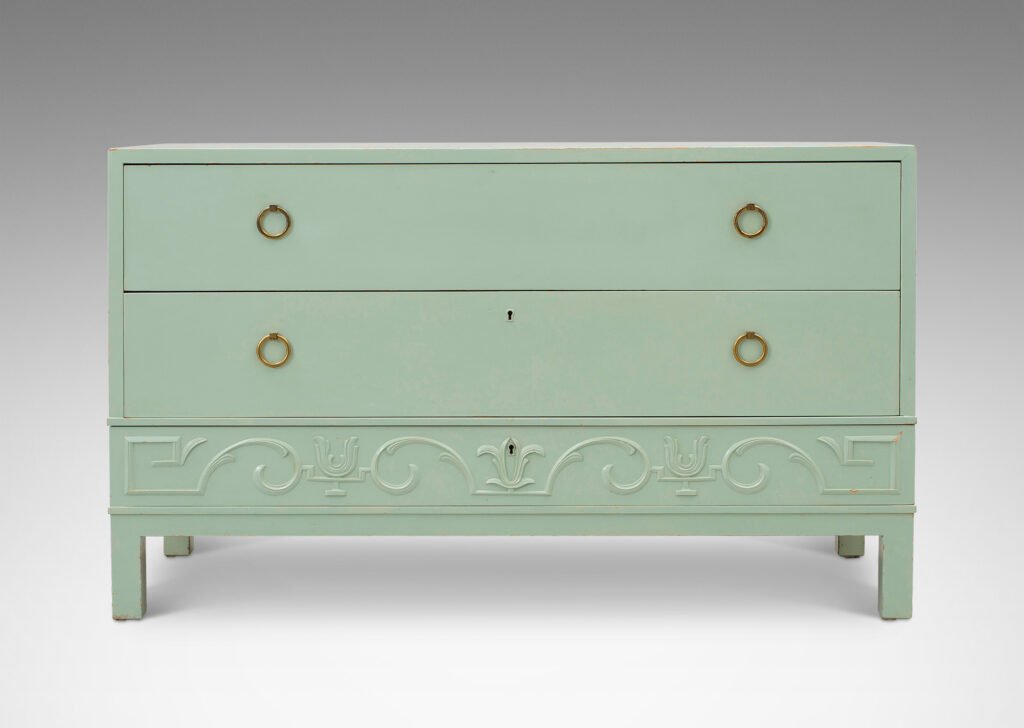 Gallery BAC three drawers, the lowest with relief classical motifs, the two above with ring pulls; birch and brass