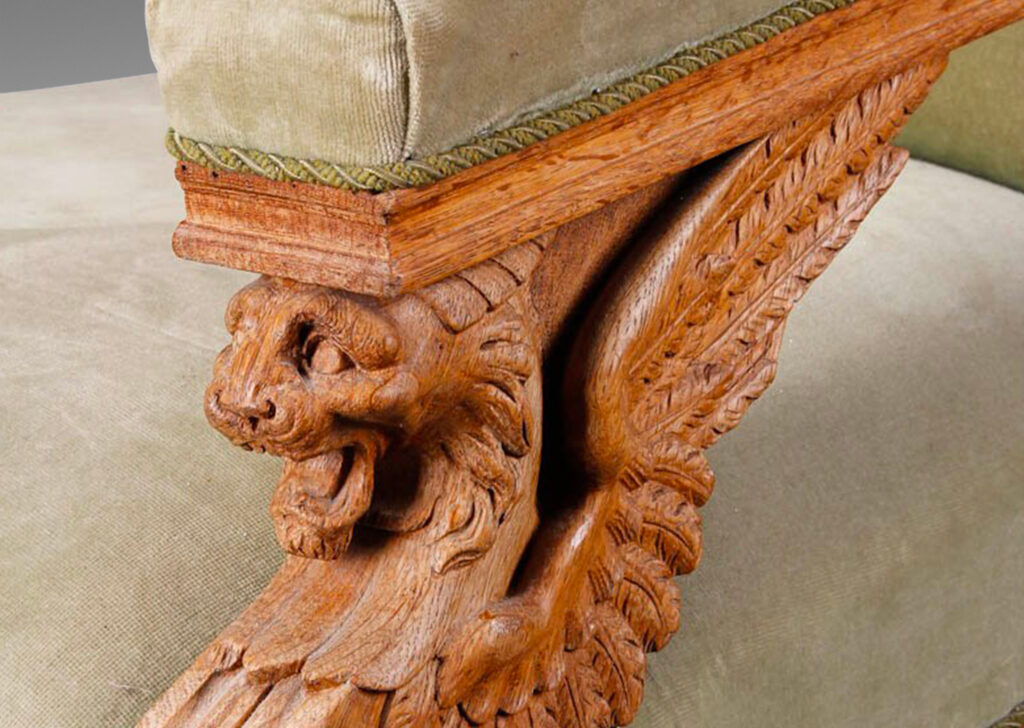 Gallery BAC carved winged lions and volutes supporting the arms, guilloche panels, turned baluster legs and scroll back with spindle detail