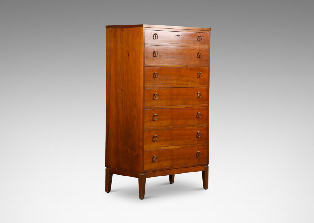 Gallery BAC tall case with four drawers, each with unique bell-shaped pulls; teak and brass