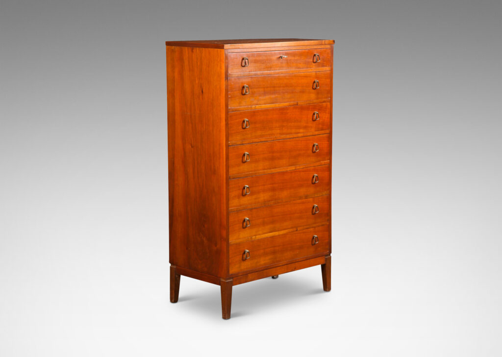 Gallery BAC tall case with four drawers, each with unique bell-shaped pulls; teak and brass