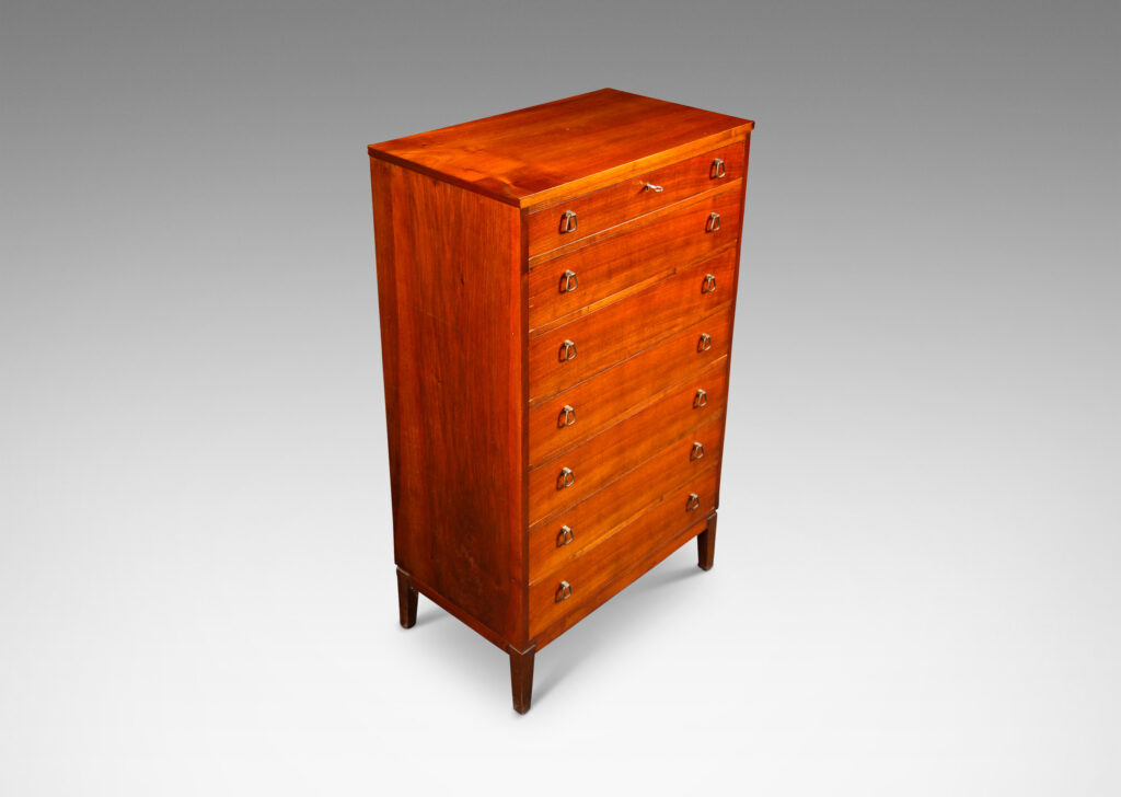 Gallery BAC tall case with four drawers, each with unique bell-shaped pulls; teak and brass