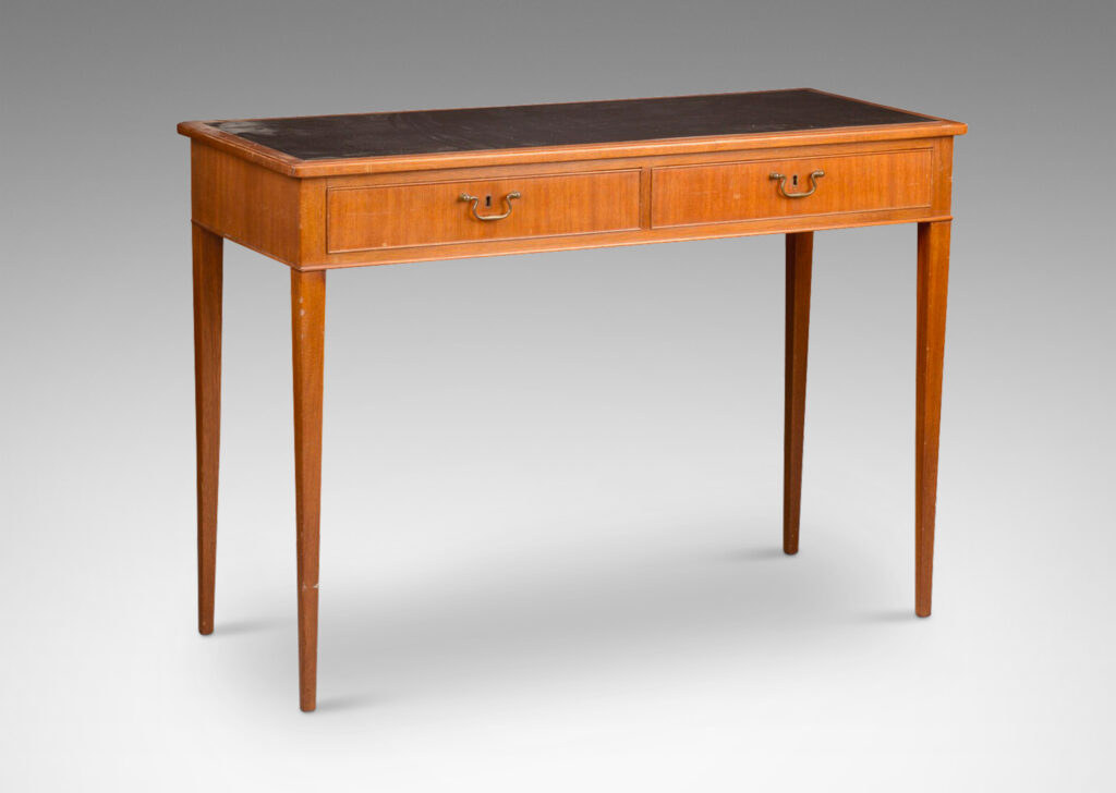 Gallery BAC two drawers with bead surrounds, tapered legs, English style pulls and inlaid top surface; mahogany with brass