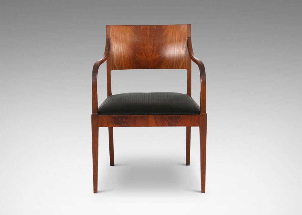 Gallery BAC klismos-style back, rolling arms and tapered legs; mahogany