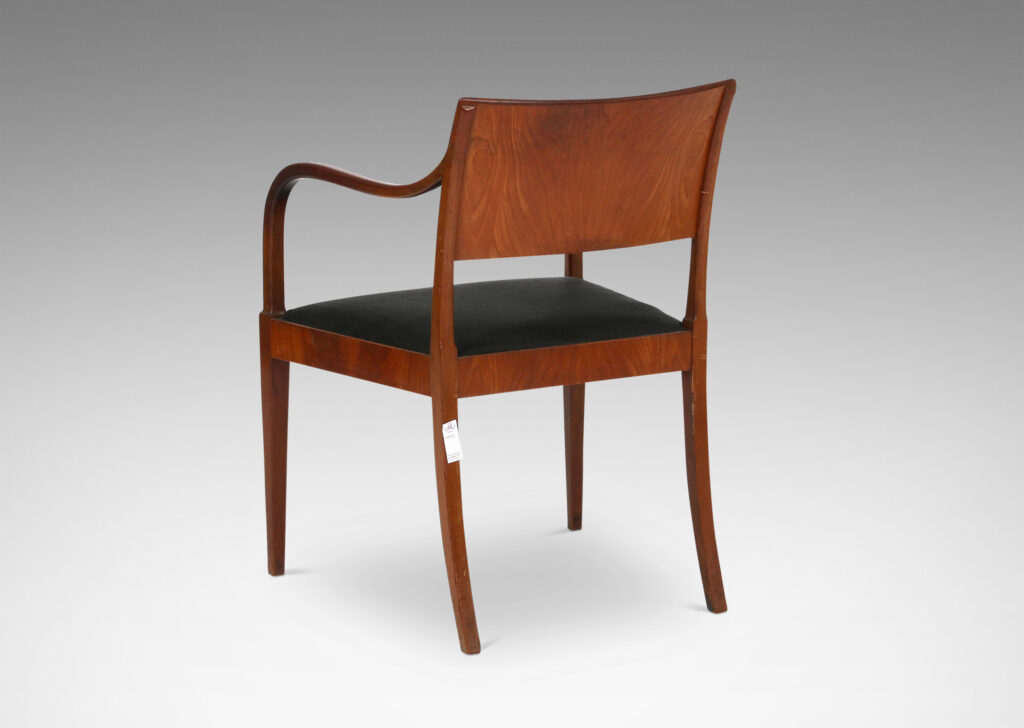 Gallery BAC klismos-style back, rolling arms and tapered legs; mahogany