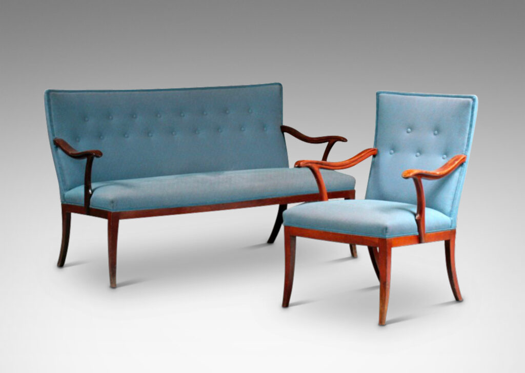 Gallery BAC arced rectangular backs, sinuously modeled arms, and tapered and sabered legs; beech