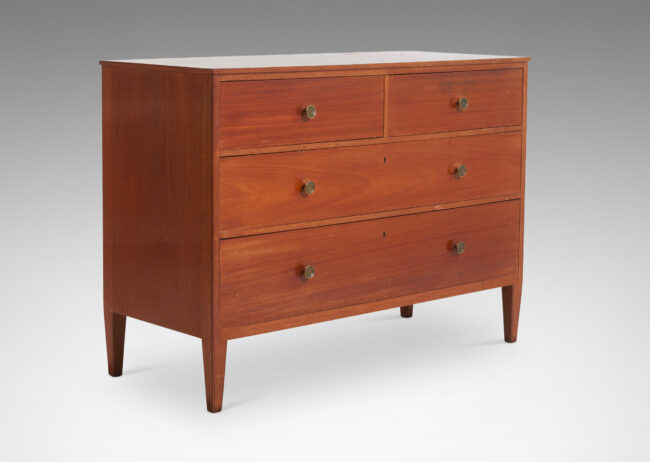 Gallery BAC simple box case with three drawers, tapered legs and round brass pulls; mahogany veneer