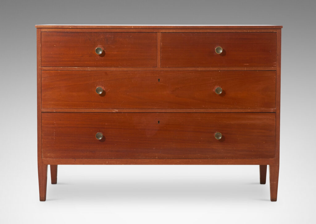 Gallery BAC simple box case with three drawers, tapered legs and round brass pulls; mahogany veneer