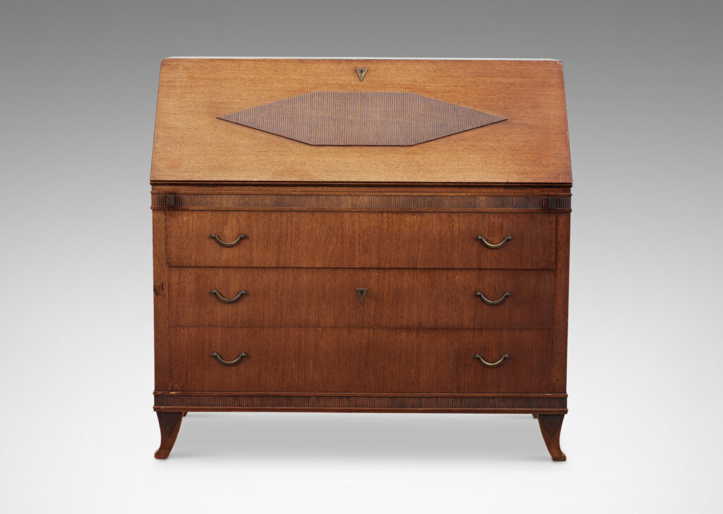 Gallery BAC hree-drawer chest on sabered feet with fold-out desk with storage nooks on top, decorated with ridged bands and ornament