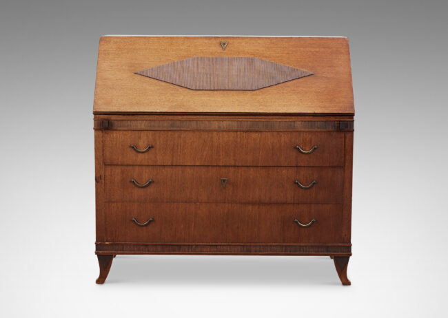 Gallery BAC hree-drawer chest on sabered feet with fold-out desk with storage nooks on top, decorated with ridged bands and ornament